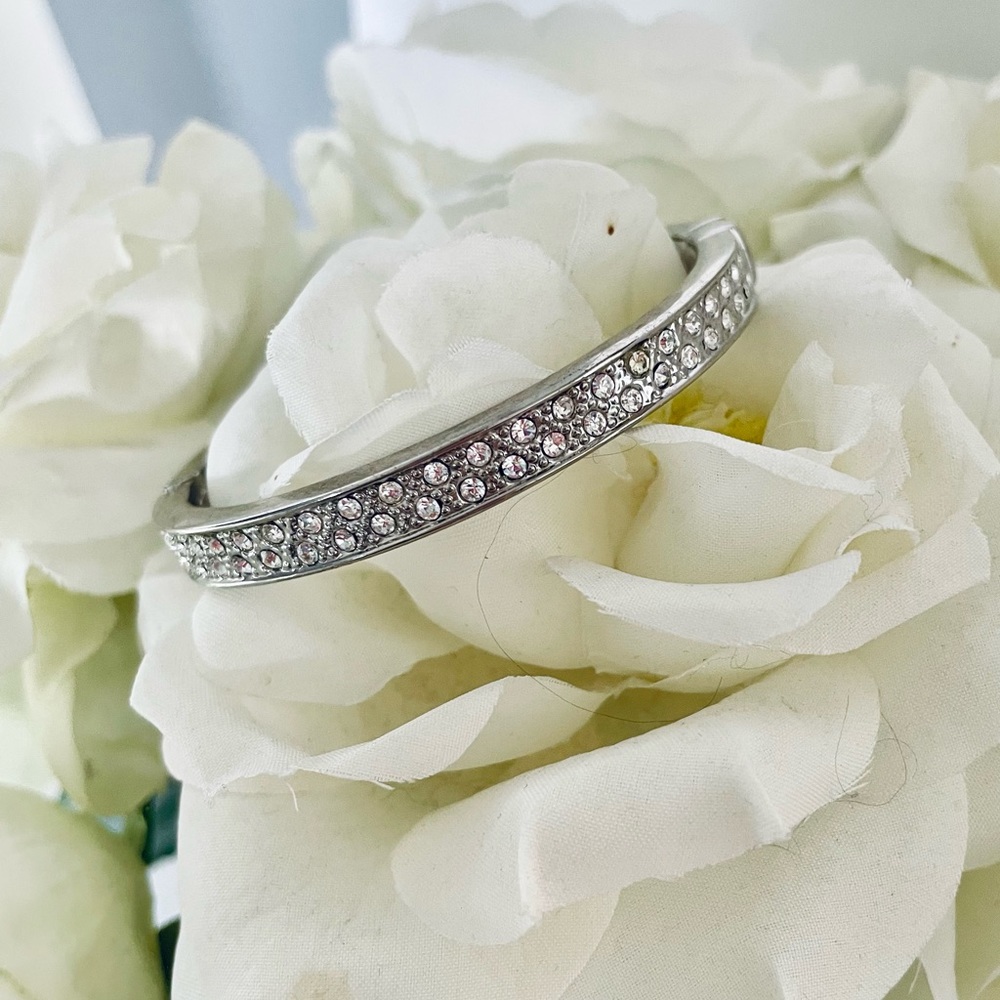 Silver tone with rhinestone detailing magnetic latch bracelet